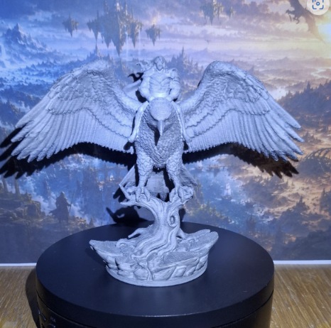 Winged guardian figure with an eagle and fully spread wings